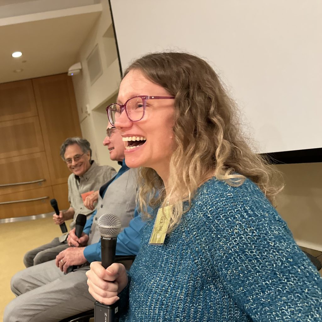 A picture of me participating in a panel at a conference held at MIT